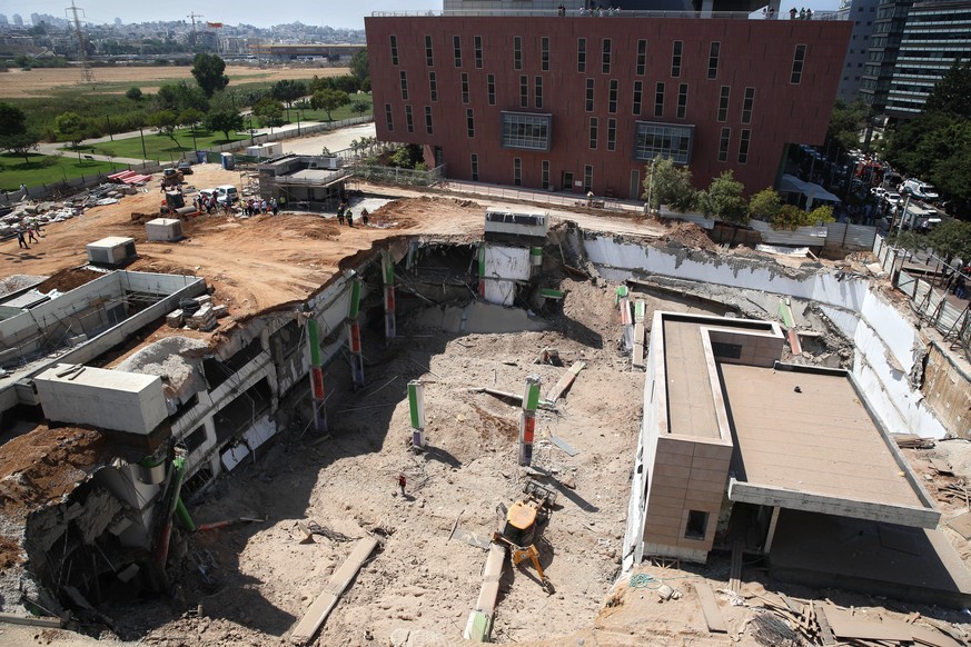 A general view of the scene of a building collapse in Tel Aviv, Monday, Sept. 5, 2016. The building collapsed in a Tel Aviv construction zone on Monday, injuring at least 18 people and trapping three  ...