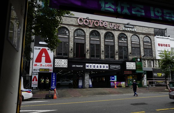 epa07743449 A South Korean man walks in front of the Coyote Ugly nightclub in Gwangju, South Korea, 27 July 2019. According media reports, a loft inside the nightclub in the southwestern city of Gwang ...