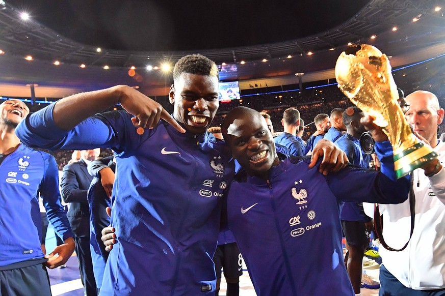 September 9, 2018 - Paris, France - Paul Pogba, N Golo Kante of France celebrate with the World Cup Trophy after the UEFA Nations League A group official match between France and Netherlands at Stade  ...