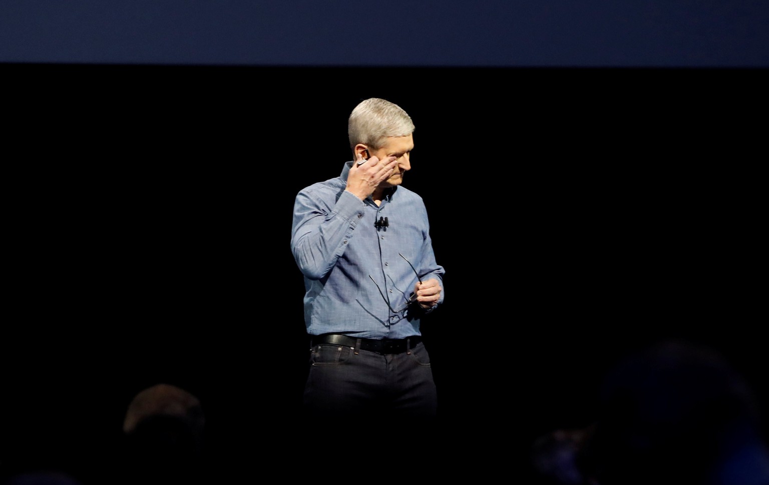 Apple Inc. CEO Tim Cook wipes his eyes after leading a moment of silence for the victims of the attack in Orlando as he opens the company&#039;s World Wide Developers Conference in San Francisco, Cali ...
