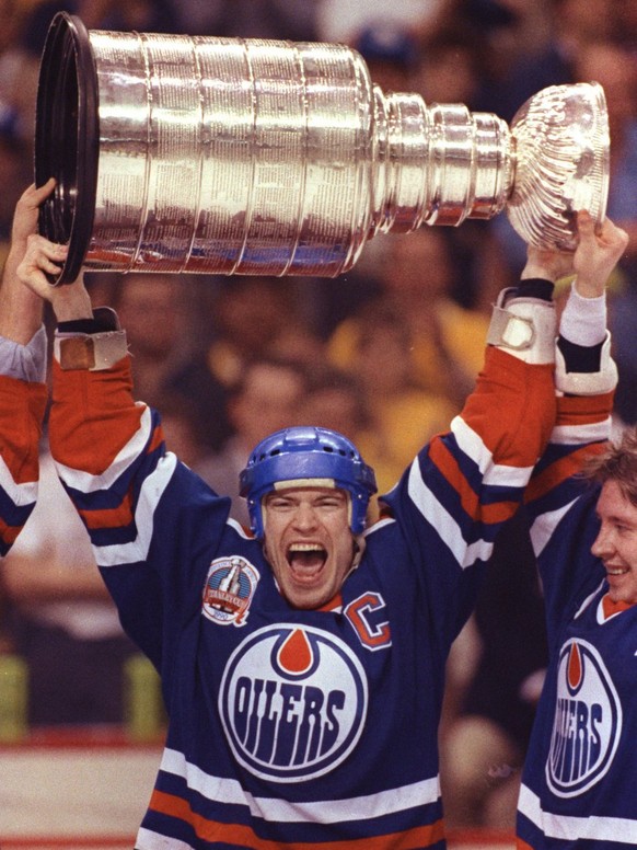 Edmonton Oilers&#039; captain Mark Messier holds up the Stanley Cup trophy after the Oilers beat the Boston Bruins in this May 1990 photo. Messier retired Monday,Sept. 12, 2005 ending a 25-year career ...