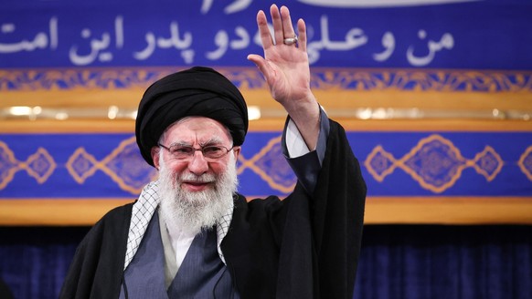 epa12622672 A handout picture made available by Iran's Supreme Leader Office shows Ayatollah Ali Khamenei greeting a crowd during a ceremony in Tehran, Iran, 03 January 2026. Khamenei commented o ...