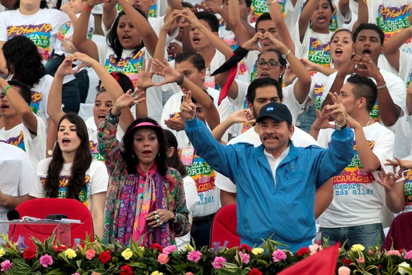 Nicaragua&#039;s President Daniel Ortega and first lady Rosario Murillo greet supporters during celebrations to mark the 37th anniversary of the Sandinista Revolution at the Juan Pablo II square in Ma ...