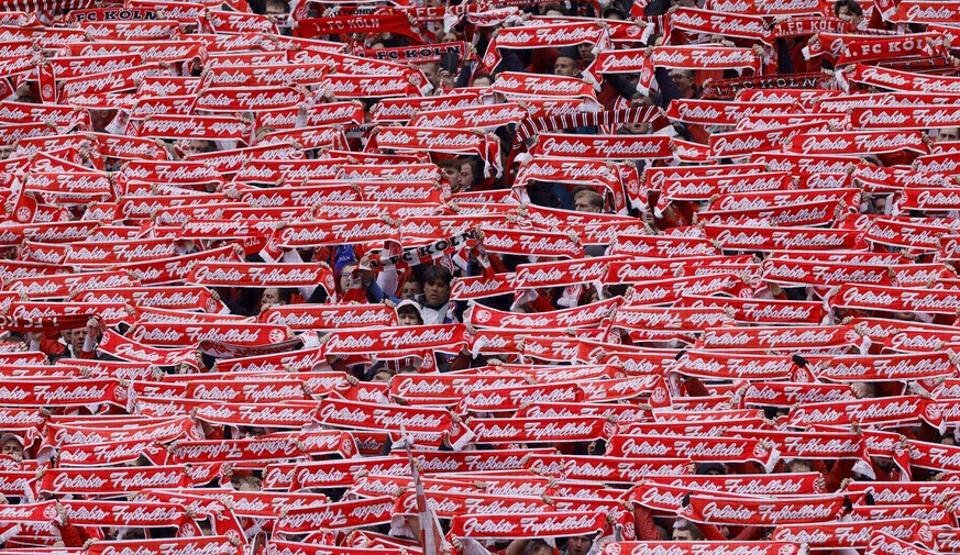 epa10555455 Fans of Cologne cheer during the German Bundesliga soccer match between 1. FC Cologne and Borussia Moenchengladbach in Cologne, Germany, 02 April 2023. EPA/RONALD WITTEK CONDITIONS - ATTEN ...