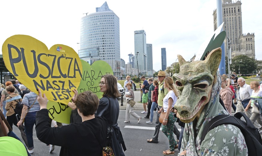 Protesters march with placard reading &quot;The Forest is Ours&quot;, demanding a stop to massive logging in the Bialowieza forest, one of Europe&#039;s last virgin woodlands, in Warsaw, Poland, Satur ...