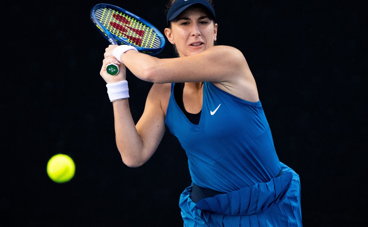epa09682100 Belinda Bencic of Switzerland in action during her quarter final match against Paula Badosa of Spain at the Sydney Tennis Classic tournament at Ken Rosewall Arena in Sydney, Australia, 13  ...