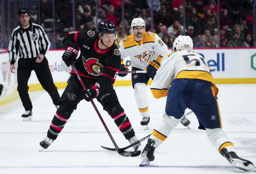 Ottawa Senators defenseman Jakob Chychrun (6) attempts to take the puck around Nashville Predators defenseman Roman Josi (59) during the second period of an NHL hockey game in Ottawa, Ontario, Monday, ...