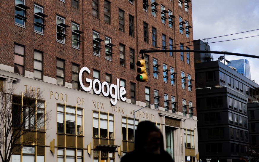 epa10418585 Signage at Google?s office building in New York, New York, USA, 20 January 2023. Alphabet, the parent company of Google, announced on 20 January plans to cut 6% of its employees, about 12, ...