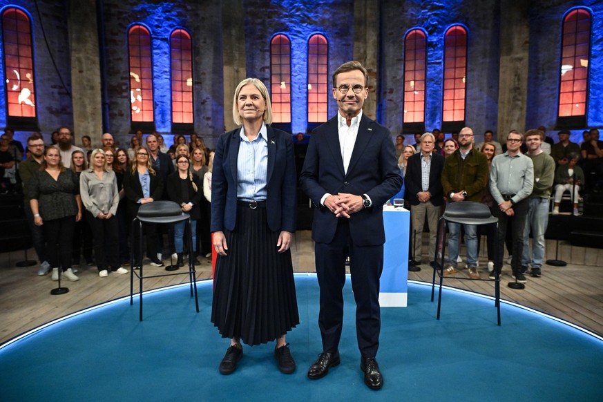 epa13226153 Sweden's Prime Ministerial candidates Magdalena Andersson (L) of the Social Democrats and Ulf Kristersson (R) of the The Moderates pose for photographers before an election debate in  ...