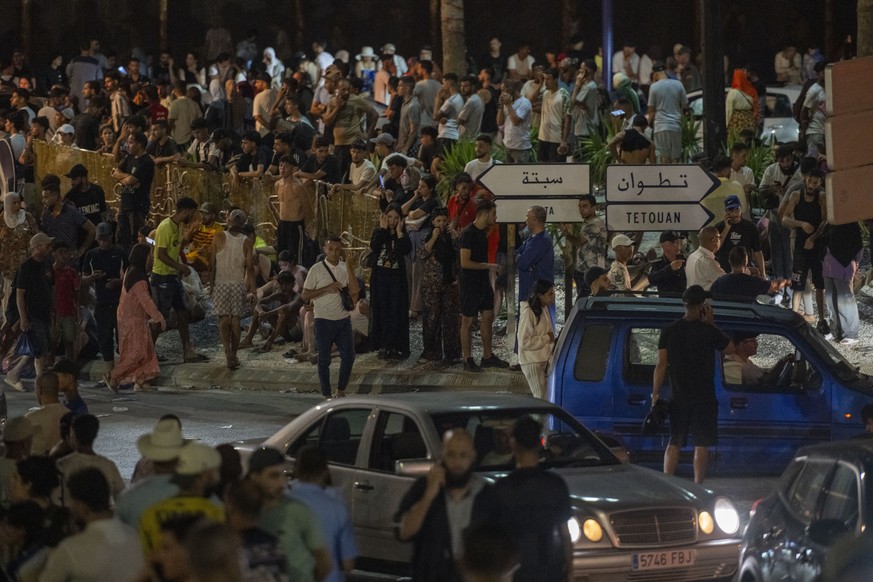 epa13142974 People gather at the Bab Sebta border crossing between Morocco and the Spanish enclave of Ceuta, near Fnideq, Morocco, 30 July 2026. Spain and Morocco agreed to the urgent return of migran ...