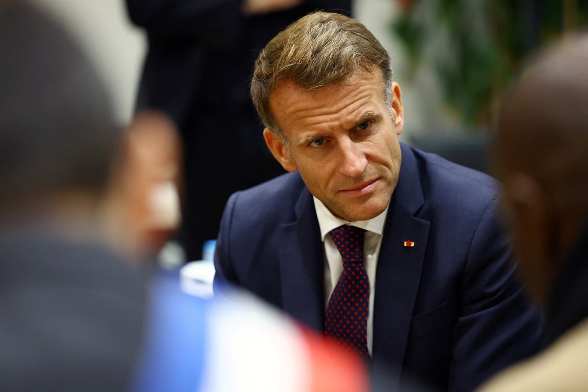French President Emmanuel Macron meets community members at the town hall in Trappes, near Paris, France, Friday Oct. 23, 2026, after a shooting in the Parisian suburb left one person dead and several ...