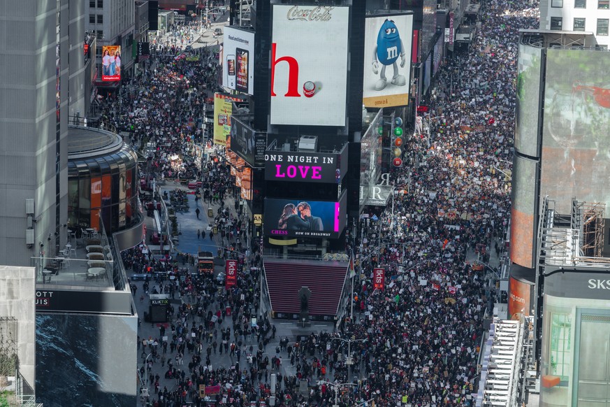 epa12857704 Thousands of protesters fill Times Square during a No Kings protest in New York, New York, USA, 28 March 2026. The 'No Kings' protests represent a massive, nationwide mobilizat ...