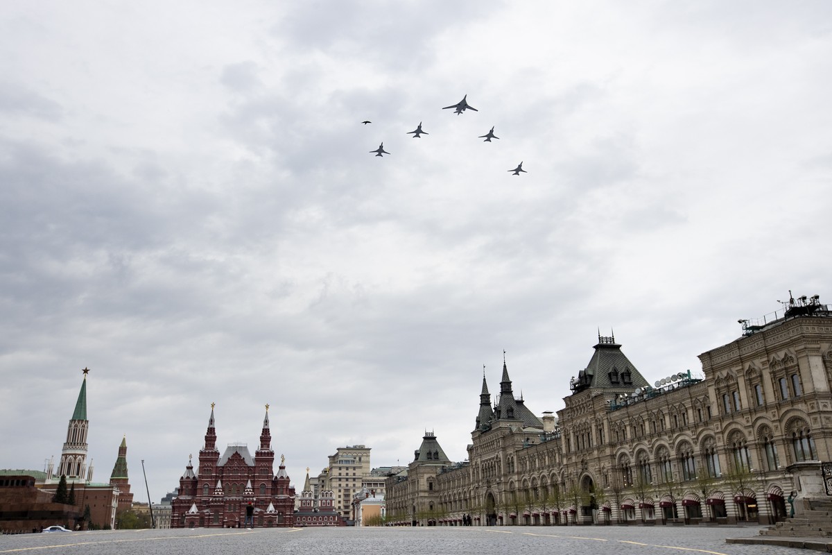 Russia's Air Force strategic bombers, Tu-160, right, and Tu-22M3, all others, fly over almost empty Red Square in Moscow, Russia, Monday, May 4, 2020. The Russian air force conducted a rehearsal  ...