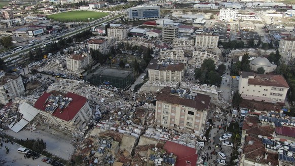 Aerial photo shows the destruction in Hatay city center, southern Turkey, Tuesday, Feb. 7, 2023. Search teams and emergency aid from around the world poured into Turkey and Syria on Tuesday as rescuer ...