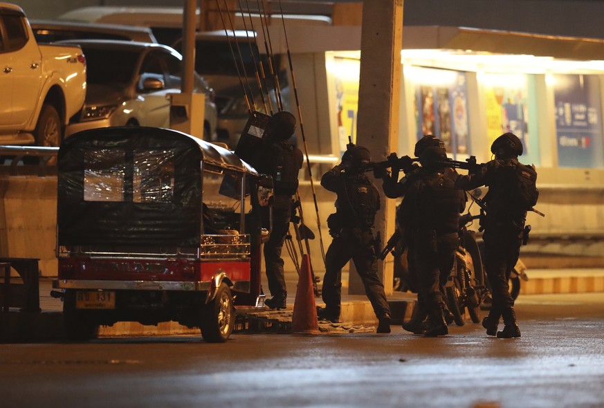 A group of armed commando soldiers are seen outside Terminal 21 Korat mall, in Nakhon Ratchasima, Thailand on Sunday, Feb. 9, 2020.A soldier who holed up in a popular shopping mall in northeastern Tha ...