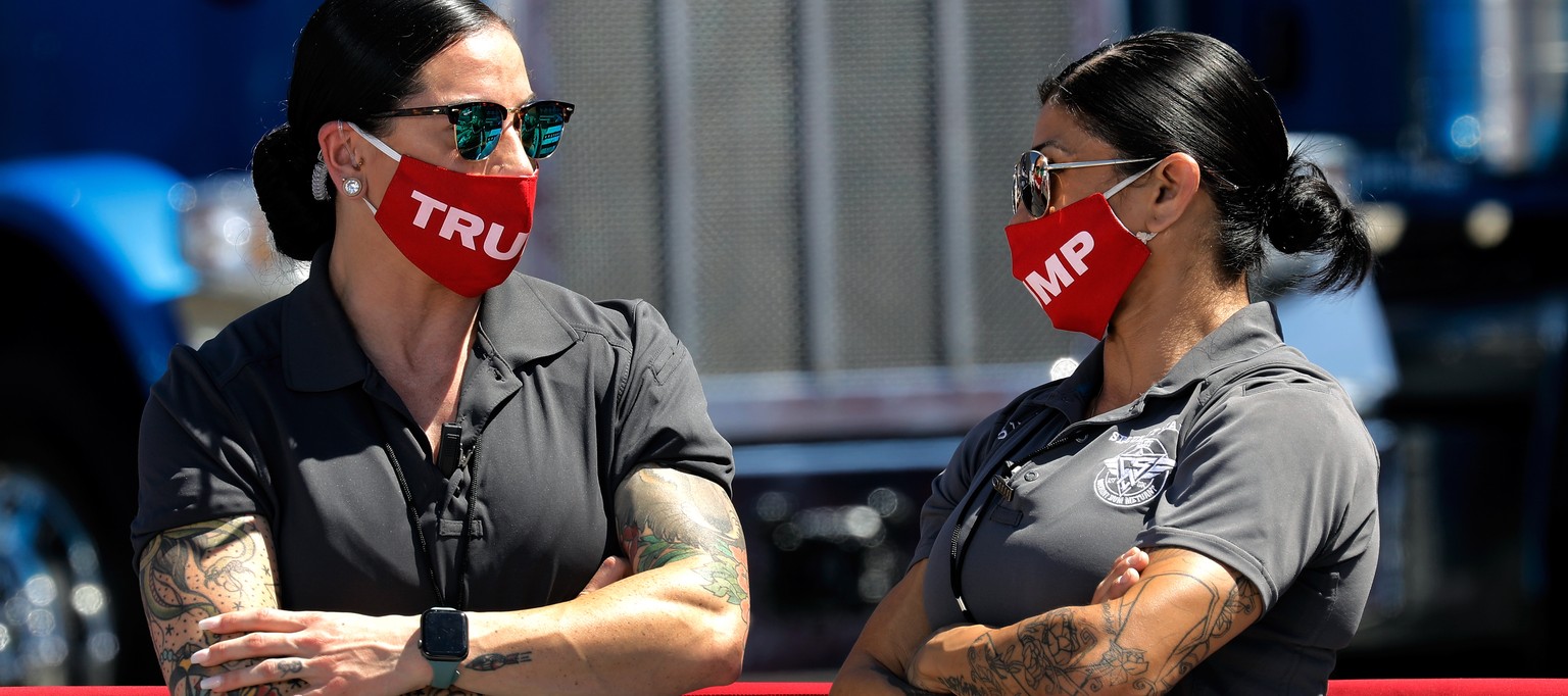 epaselect epa08615090 Security personal wear Trump face masks before US President Donald J. Trump is scheduled to speech during a campaign stop at the Miriotti Building Products Factory in Old Forge,  ...