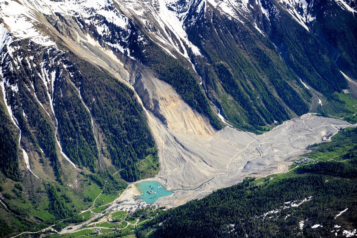 The massive landslide and debris field caused by the collapse of the Birch Glacier, which unleashed tons of rock and ice into the Loetschental valley pictured 1 year after the landslide destroyed the  ...