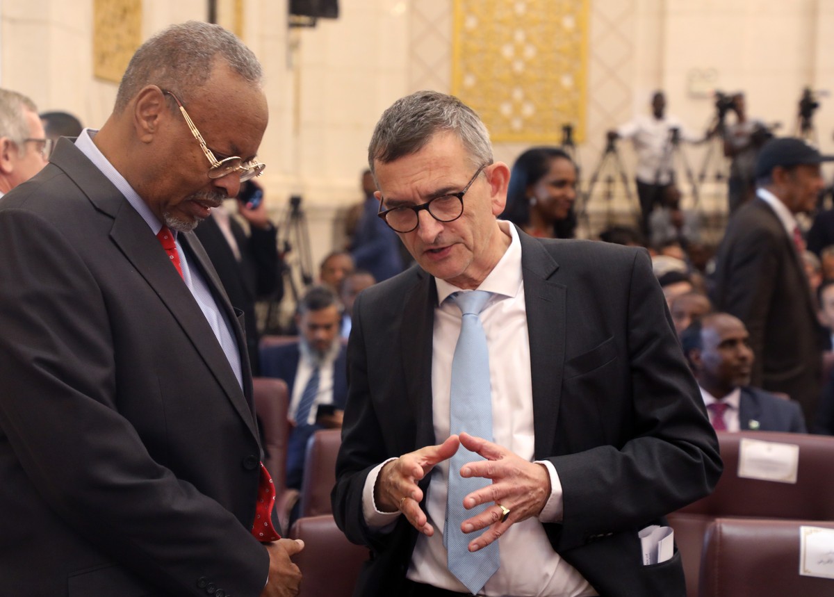 epa10349614 UN Special Representative for Sudan, Volker Perthes (R) speaks with an unidentified official while attending a ceremony to sign documents of a framework agreement to end the political stal ...