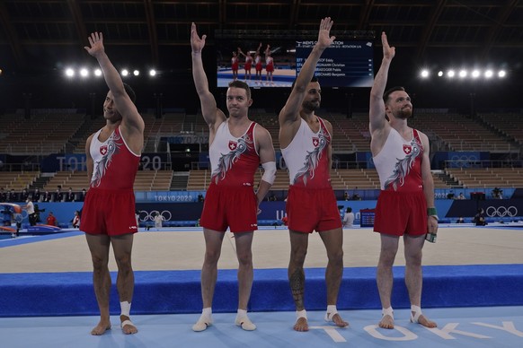 from left Switzerlan&#039;s Eddy Yusof, Christian Baumann, Benjamin Gischard and Pablo Braegger wave after performing their routines for the men&#039;s artistic gymnastic qualifications at the 2020 Su ...