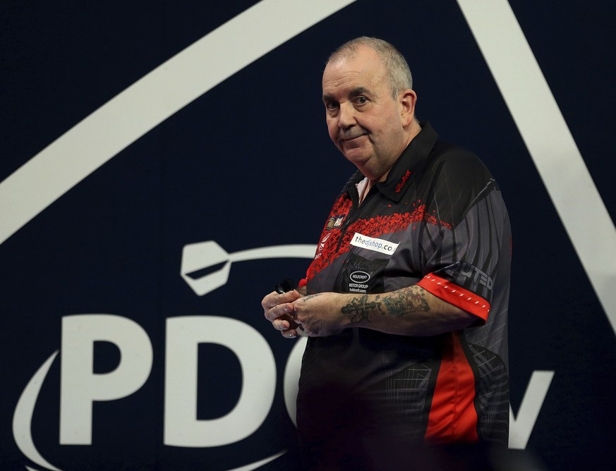 Britain&#039;s Phil Taylor in action during day ten of the World Darts Championship at Alexandra Palace, London, Saturday, Dec. 23, 2017. (Steven Paston/PA via AP)