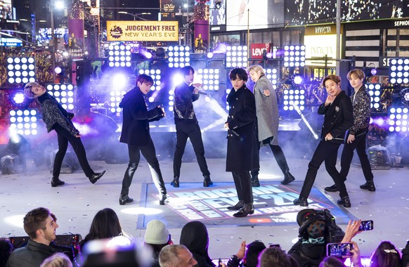 FILE - Members of BTS perform at the Times Square New Year's Eve celebration in New York on Dec. 31, 2019. The South Korean boy band BTS HAS won a leading four awards including best song for