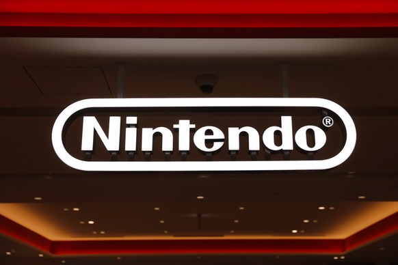 FILE - In this Jan. 23, 2020, file photo, a Nintendo sign is seen at the company's official store in the Shibuya district of Tokyo. Nintendo Co.���s profit for the fiscal year ended in March jump ...