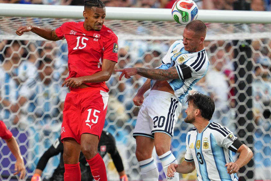 Argentina's Alexis Mac Allister (20) scores his side's opening goal during the World Cup quarterfinal soccer match between Argentina and Switzerland in Kansas City, Mo., Saturday, July 11, 2 ...