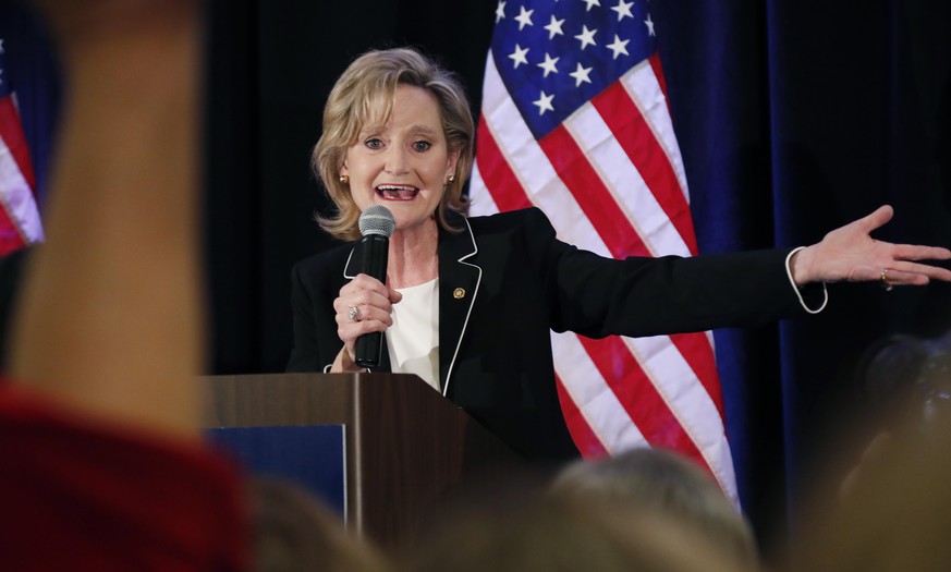 Republican U.S. Sen. Cindy Hyde-Smith calls on her family members to identify themselves as she celebrates her runoff win over Democrat Mike Espy in Jackson, Miss., Tuesday, Nov. 27, 2018. Hyde-Smith  ...