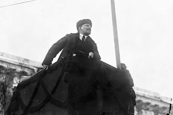 In this photo taken in Nov. 7 1918, provided by Russian State Archive of Social and Political History, Soviet leader Vladimir Lenin addresses a crowd during the first year of Revolution in Red Square  ...