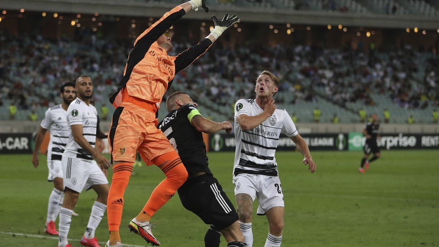 Basel&#039;s goalkeeper Heinz Lindner makes a save during the Europa Conference League, group H, soccer match between FK Qarabag and FC Basel at the Olympic stadium in Baku, Azerbaijan, Thursday, Sept ...