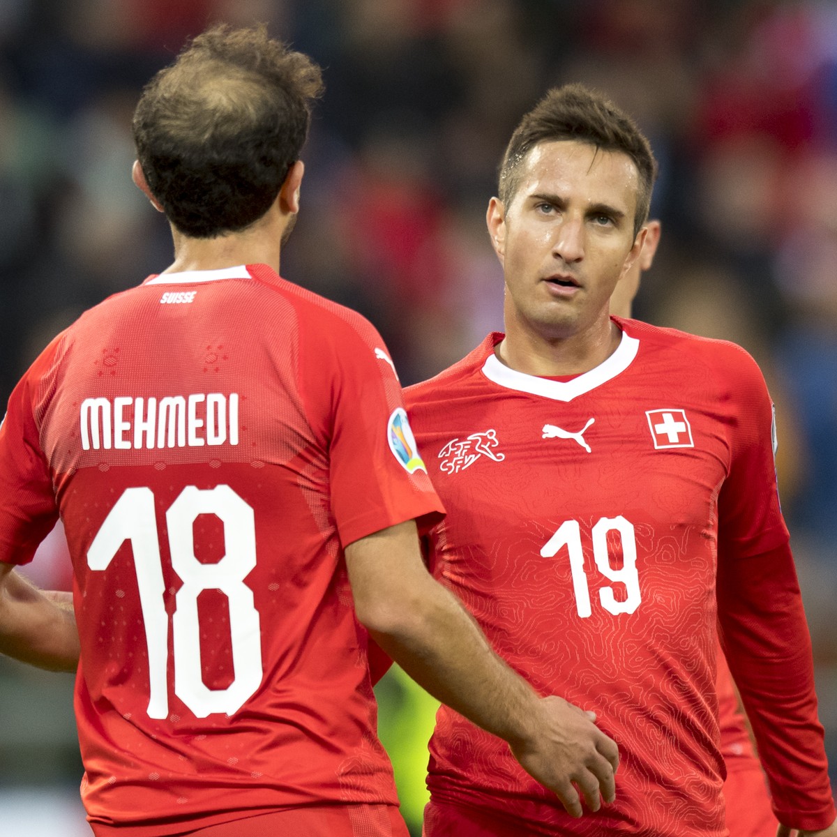 Switzerland's forward Admir Mehmedi, left, and Switzerland's forward Mario Gavranovic, right, reacts after the fourth goal during the UEFA Euro 2020 qualifying Group D soccer match between t ...