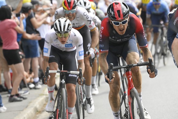 Britain&#039;s Geraint Thomas, right, and Slovenia&#039;s Tadej Pogacar, wearing the best young rider&#039;s white jersey, ride during the fifth stage of the Tour de France cycling race over 157 kilom ...