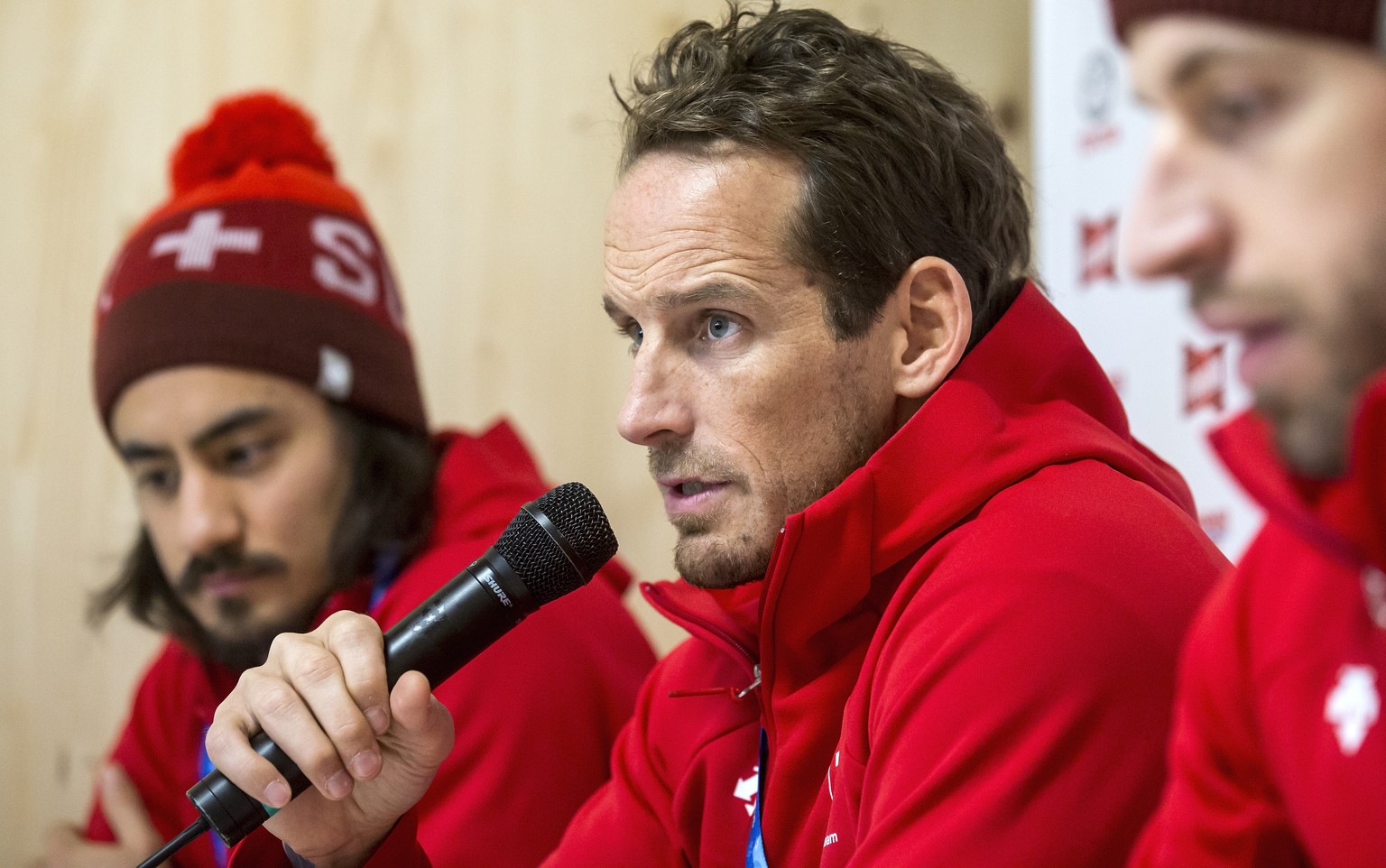 Eric Blum of Switzerland, Switzerland&#039;s head coach Patrick Fischer, and Romain Loeffel of Switzerland, from left, during a media conference of the Swiss men ice hockey national team in the House  ...