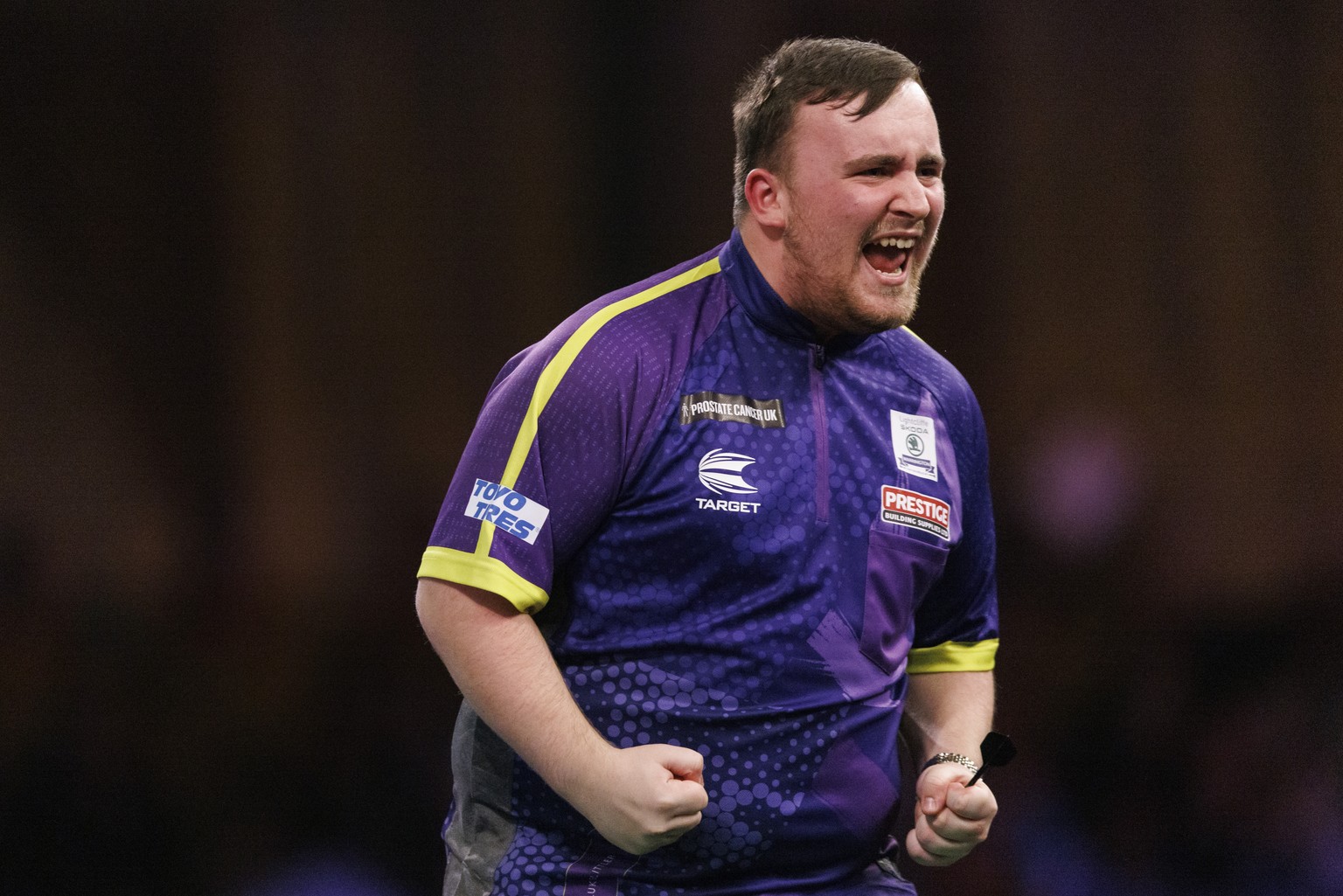 epa11054069 Luke Littler of England reacts as he plays against Rob Cross of England at the semi final match of the Paddy Power World Darts Championship, in London, Britain, 02 January 2024. EPA/TOLGA  ...