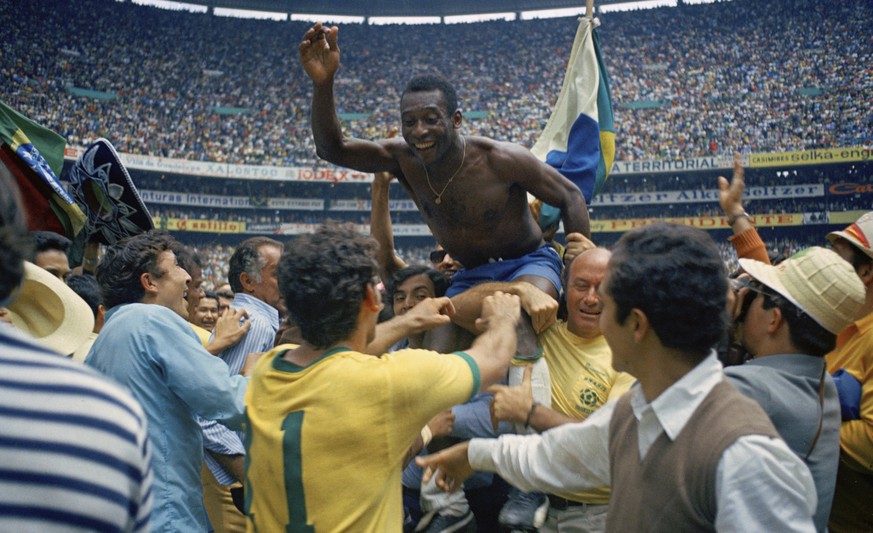 FILE - Brazil&#039;s Pele, center, is hoisted on the shoulders of his teammates after Brazil won the World Cup soccer final against Italy, 4-1, in Mexico City&#039;s Estadio Azteca, Mexico. Brazil&#03 ...