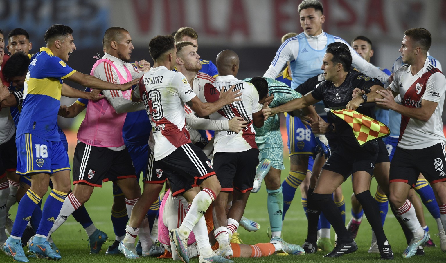 Players of River Plate and Boca Juniors fight during a local tournament soccer match at Monumental stadium in Buenos Aires, Argentina, Sunday, May 7, 2023.(AP Photo/Gustavo Garello)