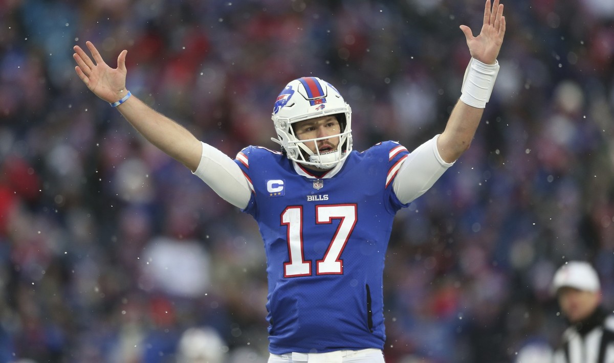 Buffalo Bills quarterback Josh Allen (17) celebrates after Devin Singletary (26) rushed for a touchdown during the second half of an NFL football game against the Atlanta Falcons Sunday, Jan. 2, 2022, ...