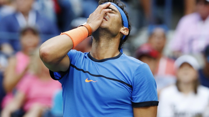 Rafael Nadal, of Spain, reacts during his match with Lucas Pouille, of France, during the fourth round of the U.S. Open tennis tournament, Sunday, Sept. 4, 2016, in New York. (AP Photo/Alex Brandon)