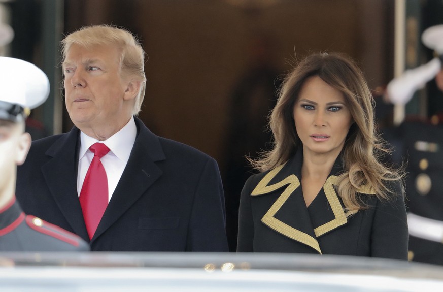 President Donald Trump and first lady Melania Trump wait to greet Australian Prime Minister Malcolm Turnbull and his wife Lucy Turnbull at the White House in Washington, Friday, Feb. 23, 2018. (AP Pho ...