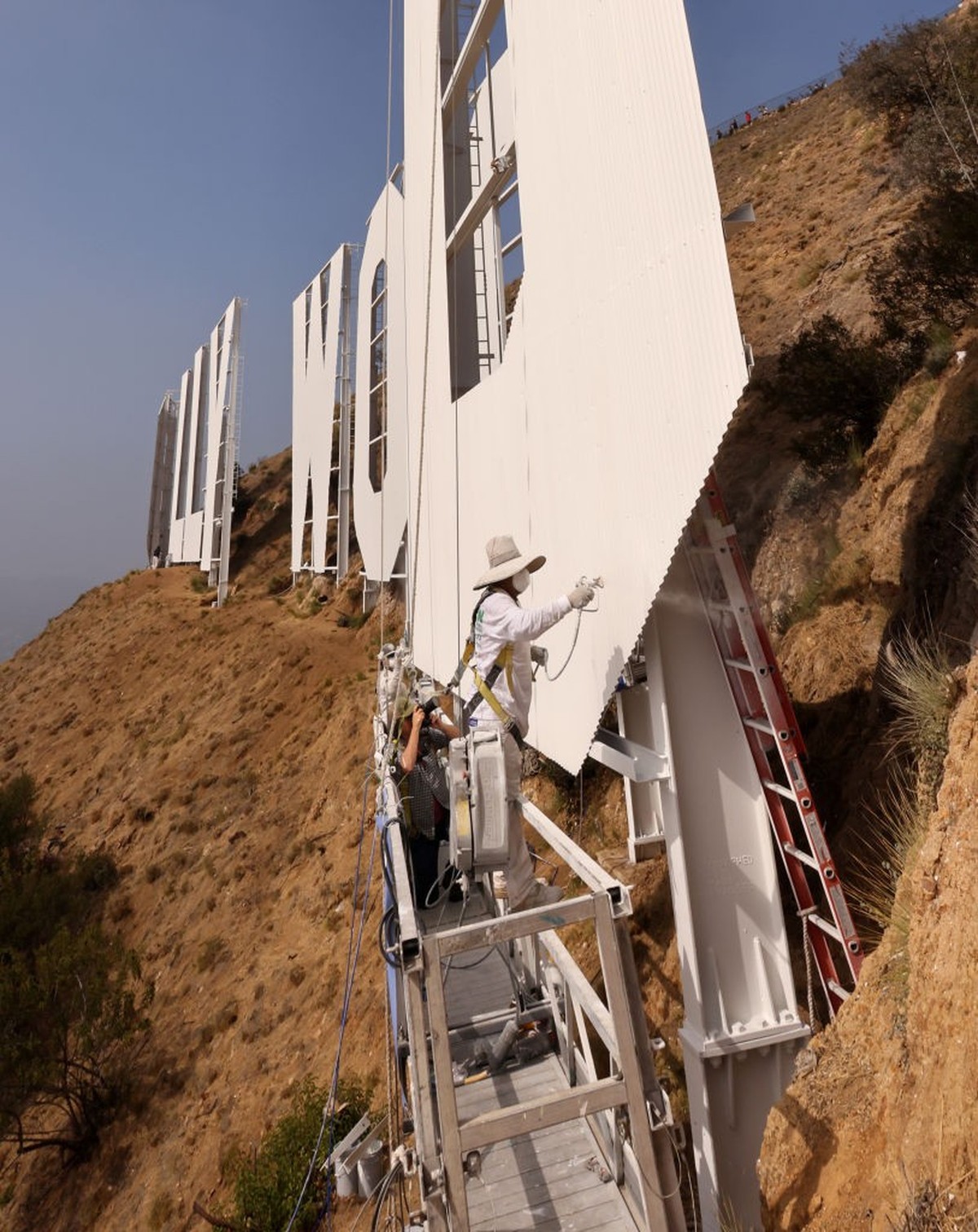 HOLLYWOOD, CALIFORNIA - OCTOBER 13: The Hollywood Sign gets repainted ahead of its 100th Anniversary on October 13, 2022 in Hollywood, California. (Photo by David Livingston/Getty Images for The Holly ...