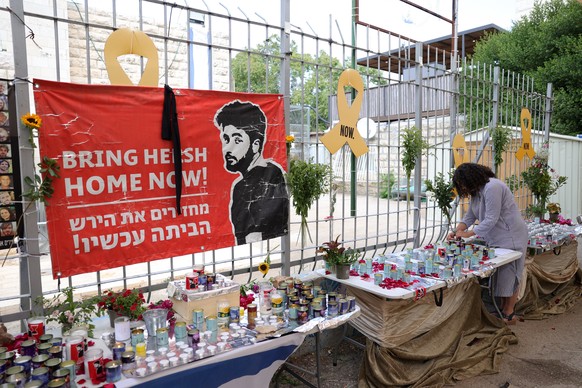 epa11577372 People light candles as they attend a memorial for late Israeli-American hostage Hersh Goldberg-Polin in a school in his neighborhood in Jerusalem, 01 September 2024. Israel Defense Forces ...