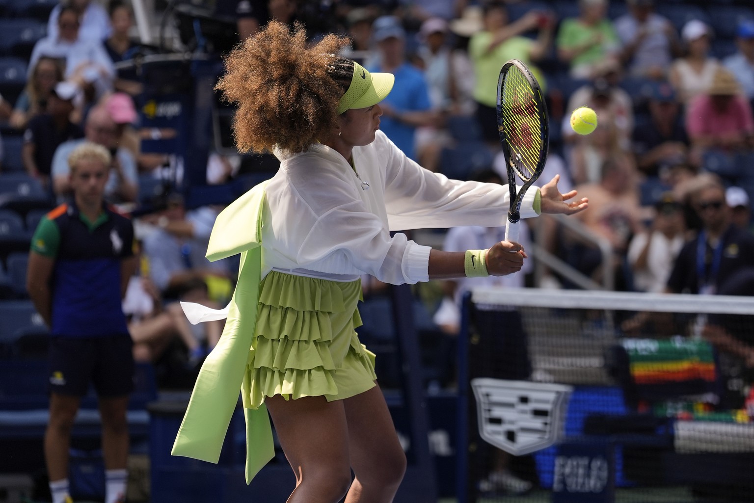 Naomi Osaka, of Japan, warms up before playing against Jelena Ostapenko, of Latvia, during the first round of the U.S. Open tennis championships, Tuesday, Aug. 27, 2024, in New York. (AP Photo/Seth We ...