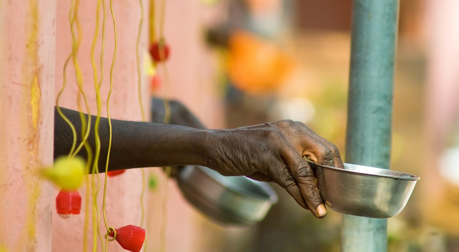 photo of hands of beggars who ask for money near Mahabodha in Bodh Gaya, Bihar, India