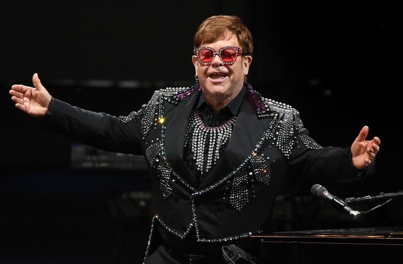 epa09471323 (FILE) - British musician Elton John performs on stage during 'A Day On The Green' music festival at Mt Duneed Estate in Geelong, Australia, 07 December 2019 (re-issued 16 September 2021). ...