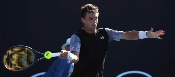 epa07281999 Henri Laaksonen of Switzerland in action during his men&#039;s singles first round match against Mirza Basic of Bosnia and Herzegovina at the Australian Open Grand Slam tennis tournament i ...