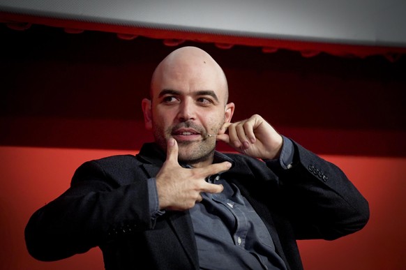 epa06270070 Italian writer Roberto Saviano attends the presentation of his new novel &#039;Bacio Feroce&#039; (Ferocious kiss) in the Cinema &#039;Modernissimo&#039; in Naples, 16 October 2017. EPA/CI ...