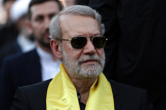 epa12826680 FILE Iran's Supreme National Security Council Secretary Ali Larijani attends a gathering to mark the death anniversary of former Hezbollah leader Hassan Nasrallah outside his grave in ...