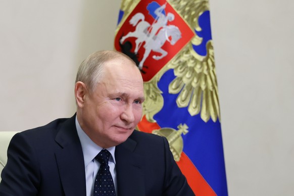 Russian President Vladimir Putin chairs a cabinet meeting via videoconference at the Novo-Ogaryovo state residence, outside Moscow, Russia, Tuesday, Jan. 24, 2023. (Mikhail Klimentyev, Sputnik, Kremli ...