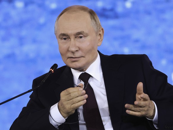 In this photo released by the Roscongress Foundation, Russian President Vladimir Putin gestures as he speaks at the plenary session of the Eastern Economic Forum in Vladivostok, Russia, Friday, Sept.  ...