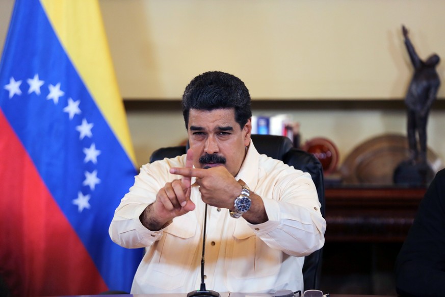 epa06216936 A handout photo made available by Miraflores Presidential Palace shows Venezuelan President Nicolas Maduro during a government meeting in Caracas, Venezuela, 20 September 2017. According t ...